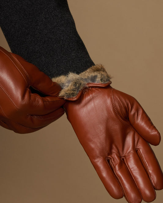 Brown leather glove cuff with visible plush fur lining detail