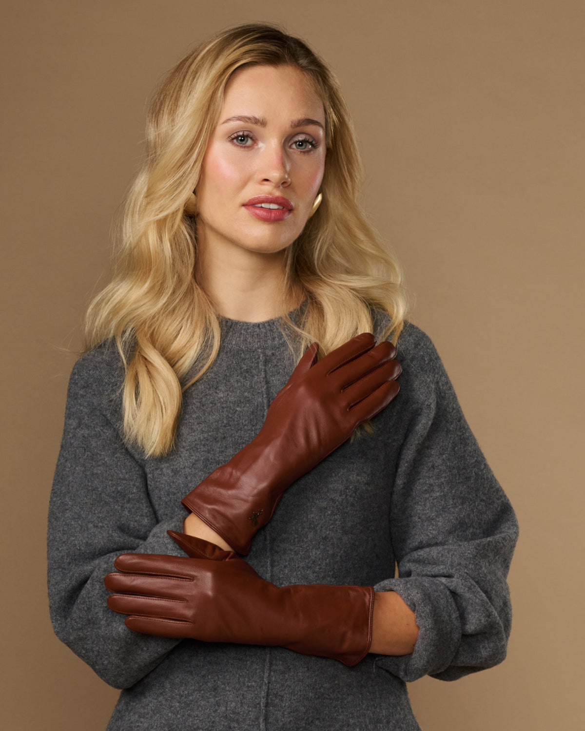 Extra-long cognac leather gloves with stitched wrist and hand-seam panels