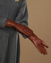 Extra-long cognac leather gloves with stitched fingertips and smooth palm