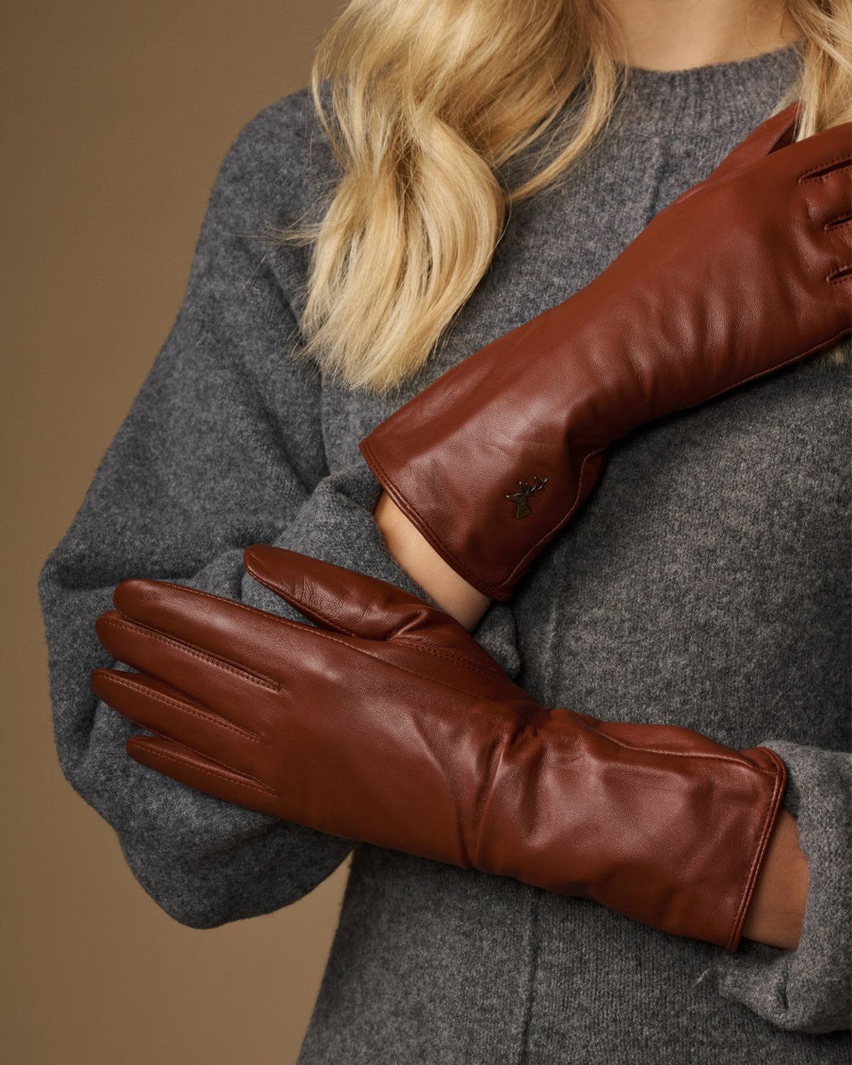 Extra-long cognac leather gloves with smooth cuffs and stitched finger seams