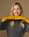 Yellow extra-long leather gloves with cashmere lining; cuff logo and touchscreen fingertip area