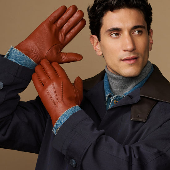Men's cognac leather gloves raised, blue lambswool lining at cuffs