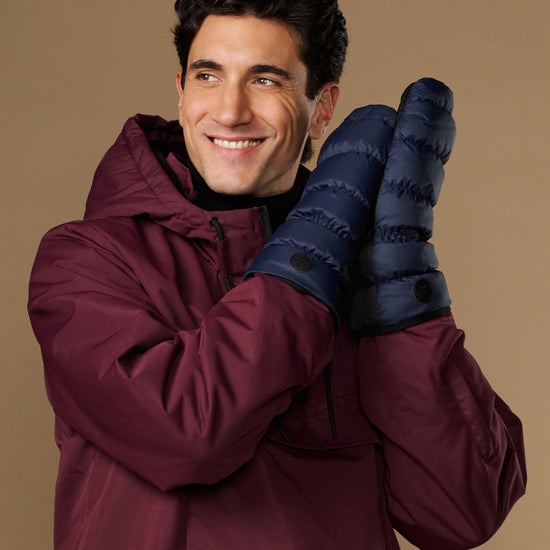 Blue down mittens with wide cuffs and button detail on the wrist