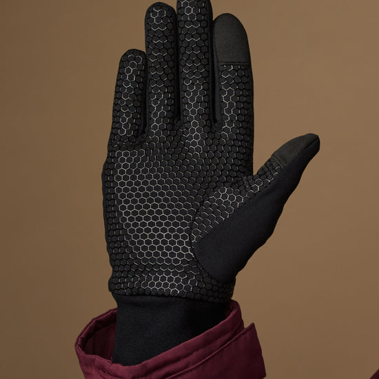 Black activity glove with a textured grip palm and reinforced fingertips