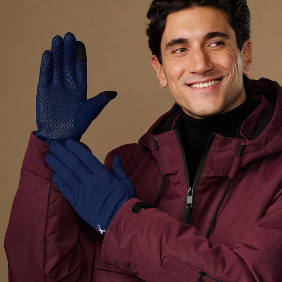 Blue activity gloves with textured grip palms, worn by a model