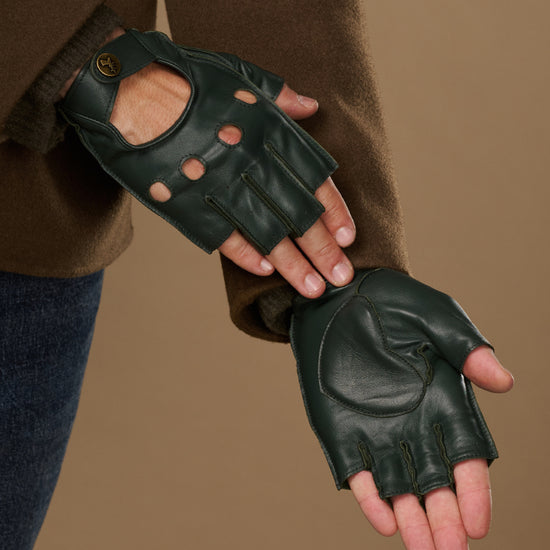 Dark green fingerless lambskin gloves showing perforated backs and stitched palm padding