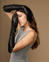 Women’s black leather elbow gloves, close-up of cuffs and knuckle area
