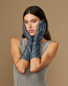 Women’s grey below-elbow leather gloves paired together, snug finger design