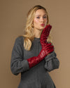 Red lambskin leather mid-forearm gloves with snug fit and smooth cuff finish