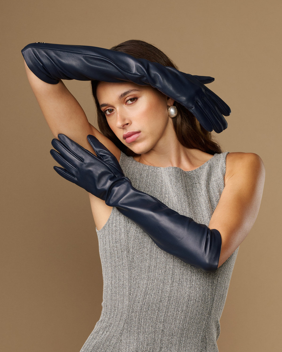Women's blue leather elbow gloves with long cuff and glossy finish