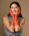Women’s orange below-elbow leather gloves with smooth cuffs and full finger coverage