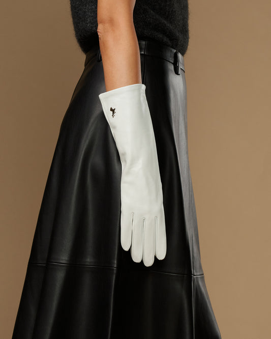 White mid-forearm leather glove with smooth cuff and small logo detail, single-hand view