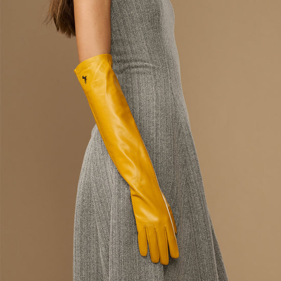 Yellow leather elbow gloves with long cuffs and tapered fingers